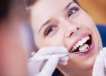 Woman recieving dental exam