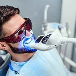 a patient receiving teeth whitening in Falls Church